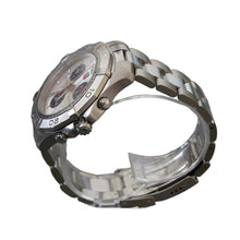 Load image into Gallery viewer, Silver watch on a clear stand with a gray background