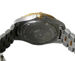 Close-up of a watch case with brand logo on a gray background