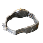 Silver watch with a metallic band on a gray surface
