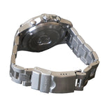 Silver watch with metal band on a gray surface