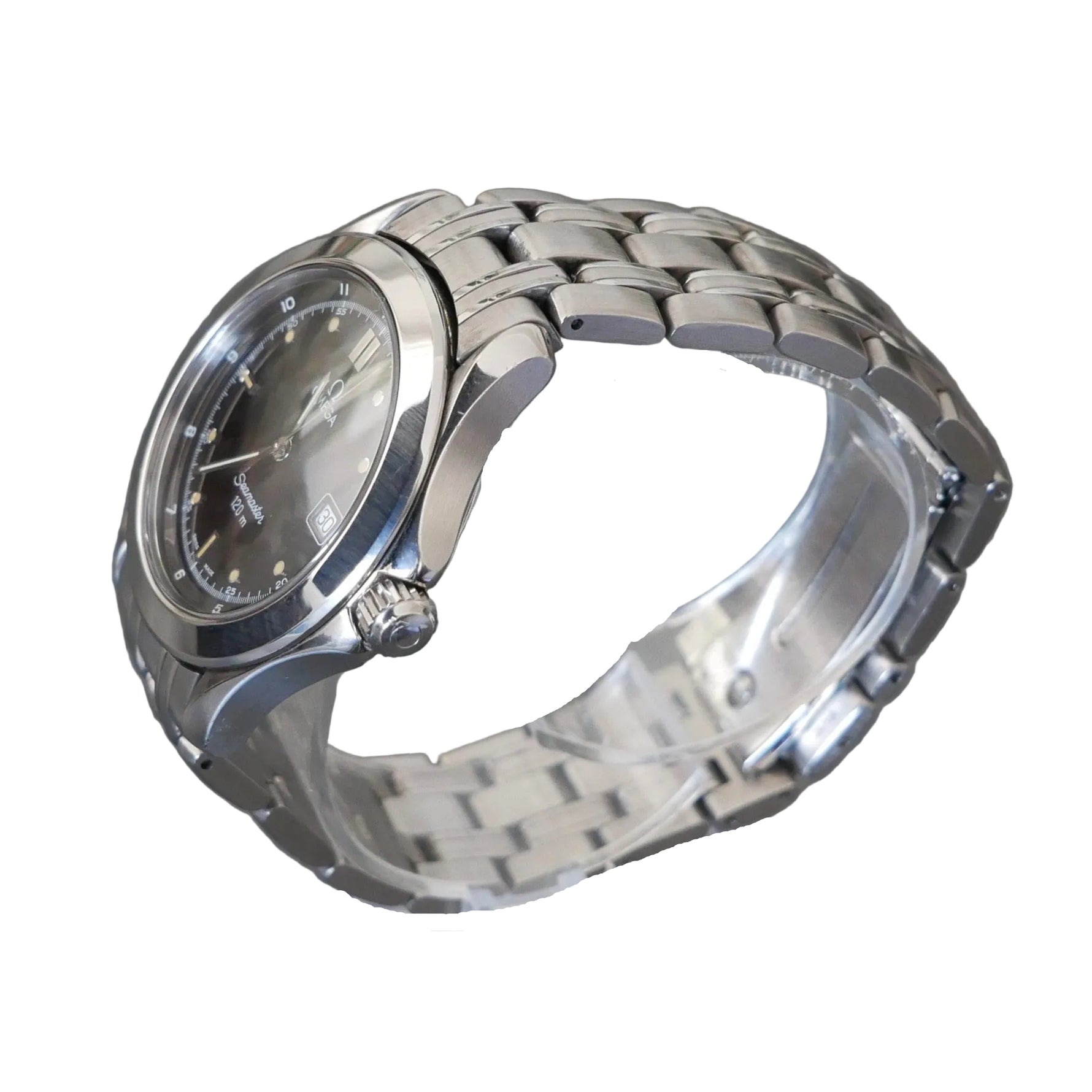 Silver watch on a clear stand against a gray background