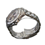 Silver watch on a clear stand with a gray background