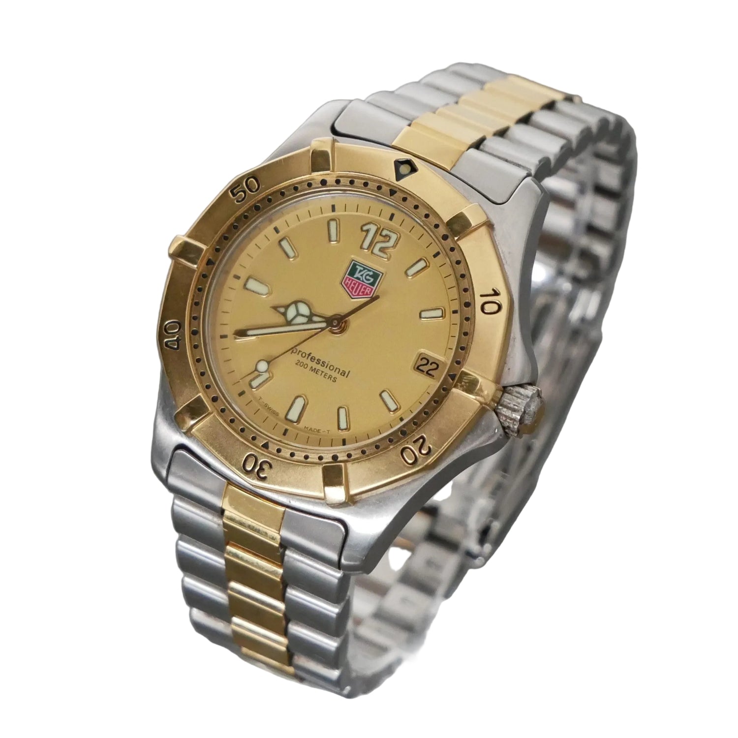 Two-tone watch with gold and silver band on a gray background