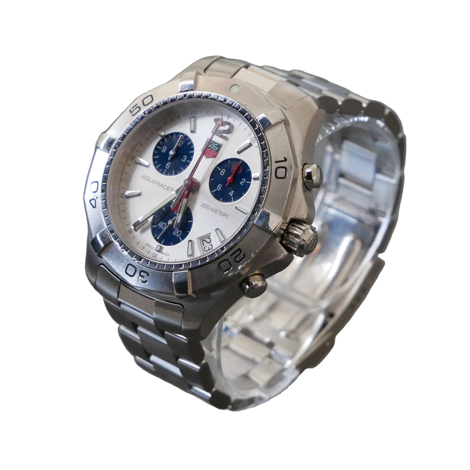Silver wristwatch with a detailed face on a gray background