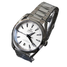 Load image into Gallery viewer, Silver Omega watch on a stand with a dark background
