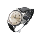 Vintage wristwatch with black strap on a gray background