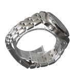 Silver watch case on a gray background