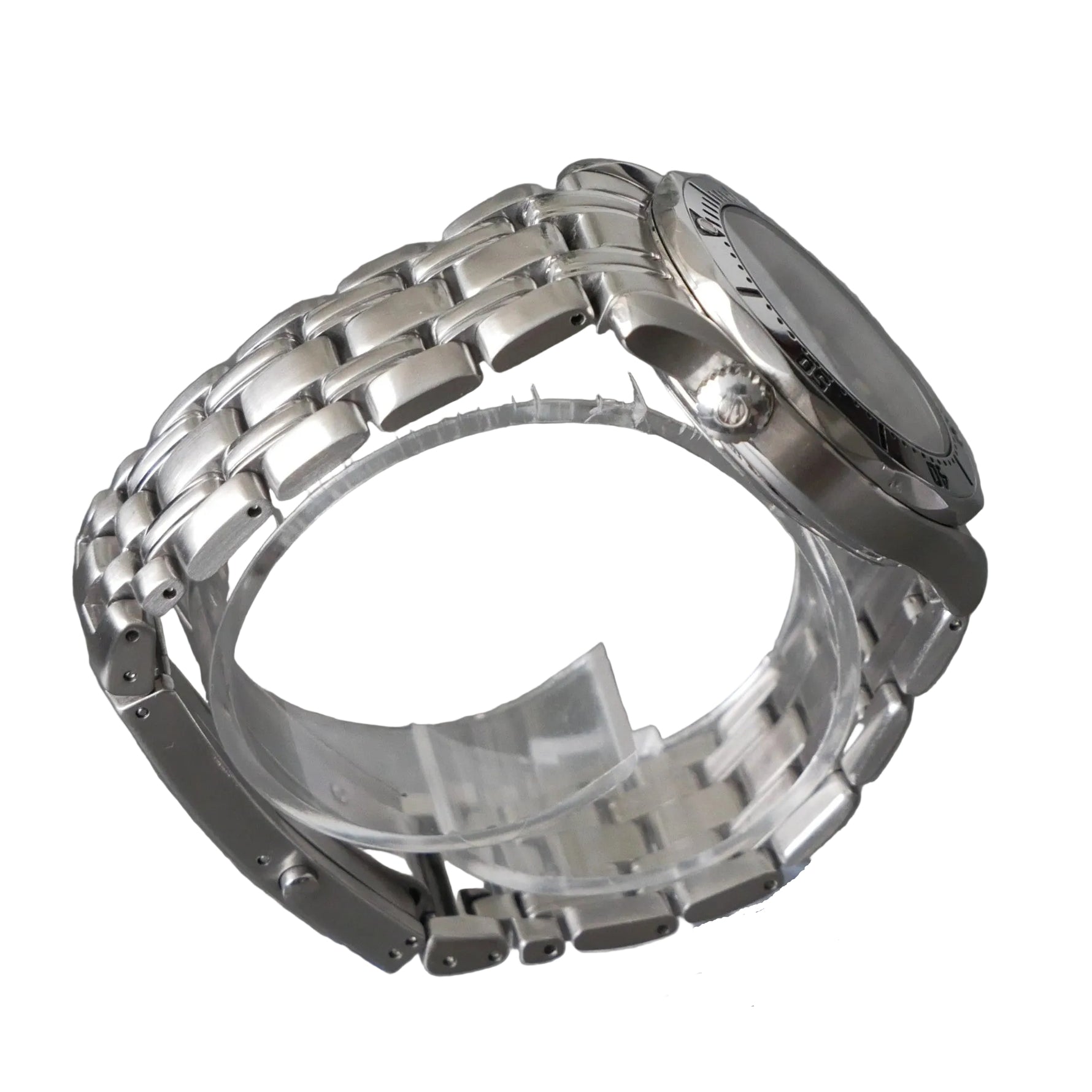 Silver watch case on a gray background