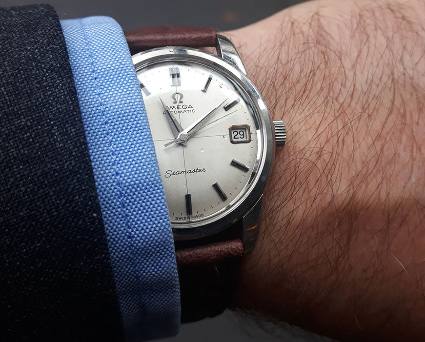 Men's Watch Omega Seamaster looking classic with a suit and blue shirt cuff