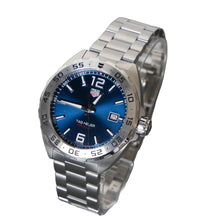 Load image into Gallery viewer, Silver watch with blue dial on a gray background

